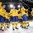 MALMO, SWEDEN - DECEMBER 29: Sweden players salute the crowd at Malmo Arena after a preliminary round win over Norway at the 2014 IIHF World Junior Championship. (Photo by Andre Ringuette/HHOF-IIHF Images)